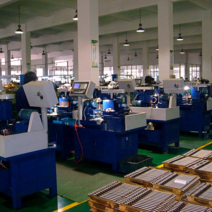 CNC machining shop floor with turned parts on pallets